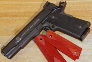 Before: A stock parkerized 1911 was degreased given wood grips, and coated with DuraBlue and DuraBlue Nitre.